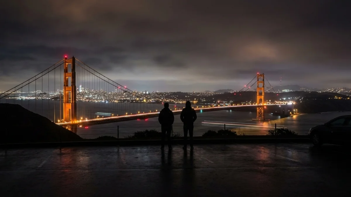 San Francisco city streets in darkness during massive power outage, traffic lights off and emergency lights visible.